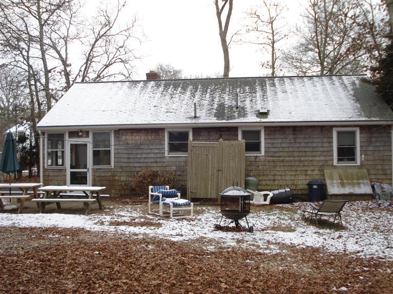94 Harbor Hills Road Centerville, MA 02632 - Photo 8 of 10 a front view of a house with patio