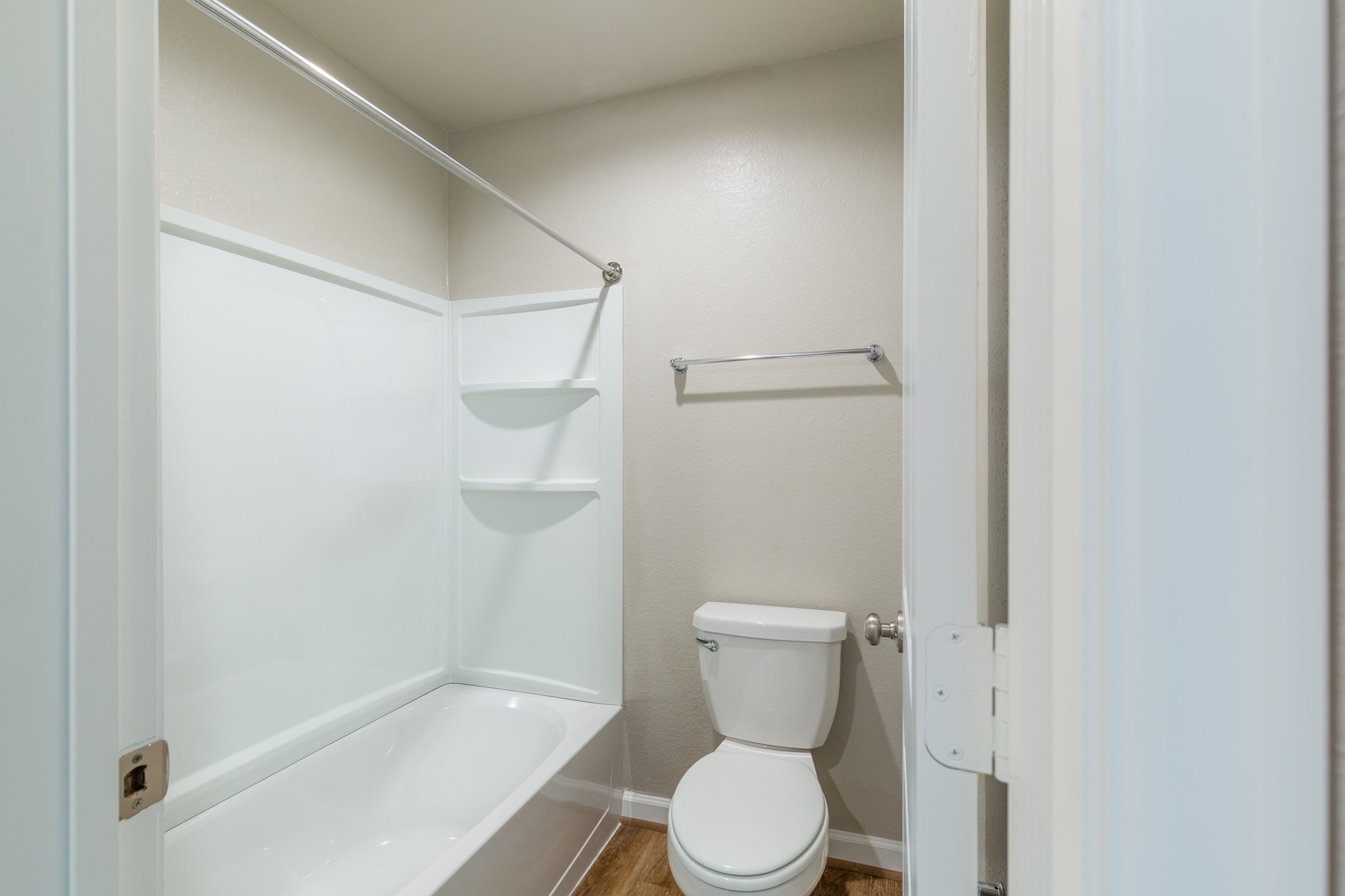 203 Park Place Circle, Unit D Waller, TX 77484 - Photo 18 of 29 a white toilet sitting next to a bath tub