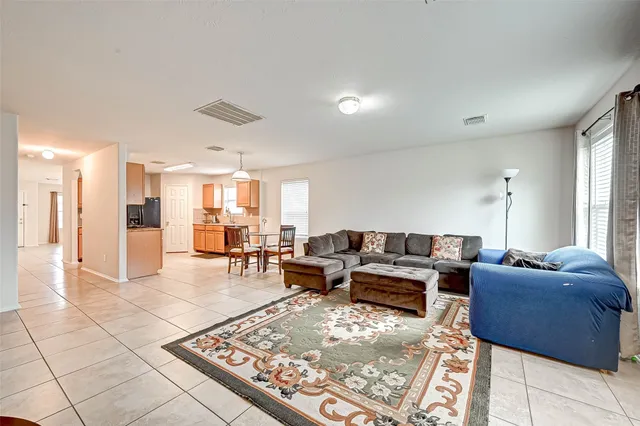 a living room with furniture and a table