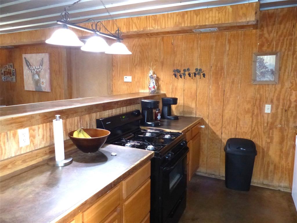 101 South Loop Drive Brady, TX 76825 - Photo 11 of 34 a kitchen with a sink and a stove top oven