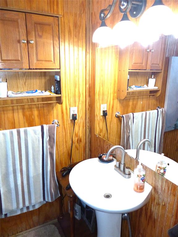 101 South Loop Drive Brady, TX 76825 - Photo 15 of 34 a bathroom with a sink and a mirror