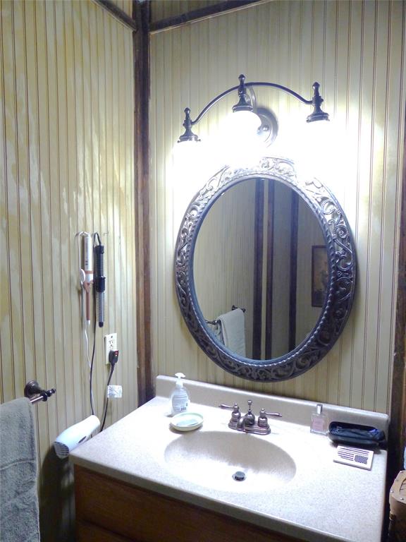 101 South Loop Drive Brady, TX 76825 - Photo 26 of 34 a bathroom with a sink and a mirror