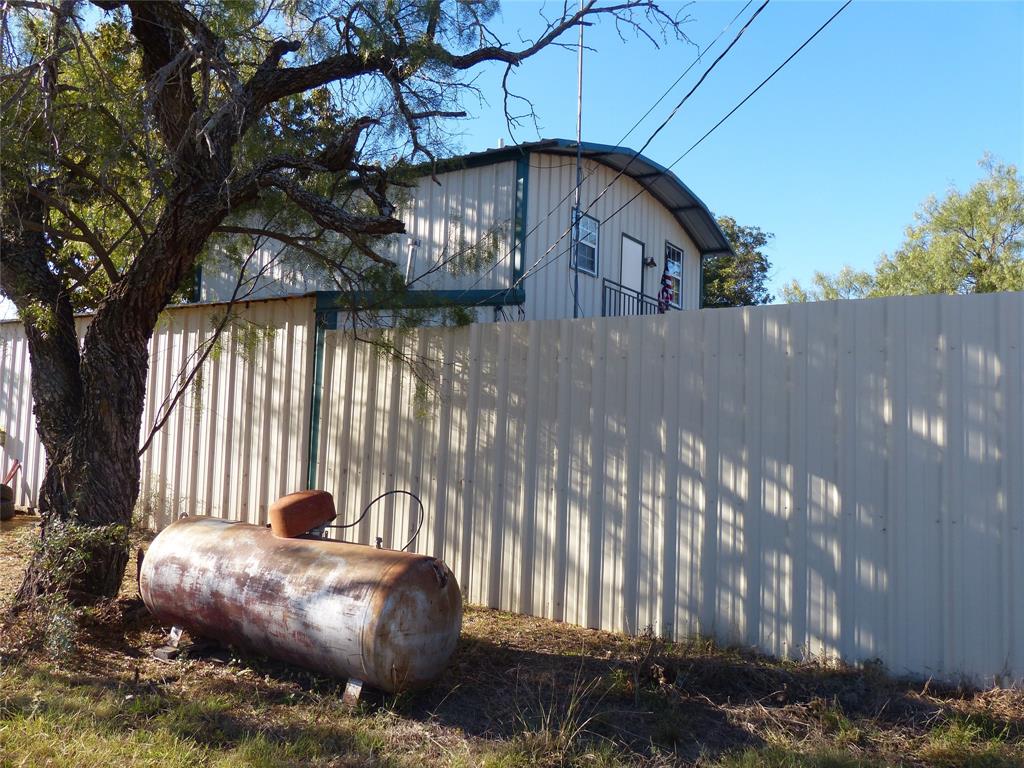 101 South Loop Drive Brady, TX 76825 - Photo 7 of 34 a view of a back yard of the house