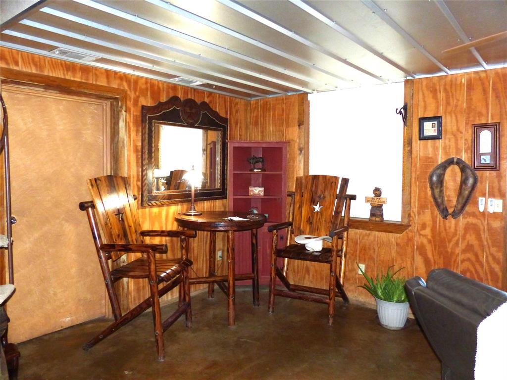 101 South Loop Drive Brady, TX 76825 - Photo 10 of 34 a view of a dining room with furniture and chandelier
