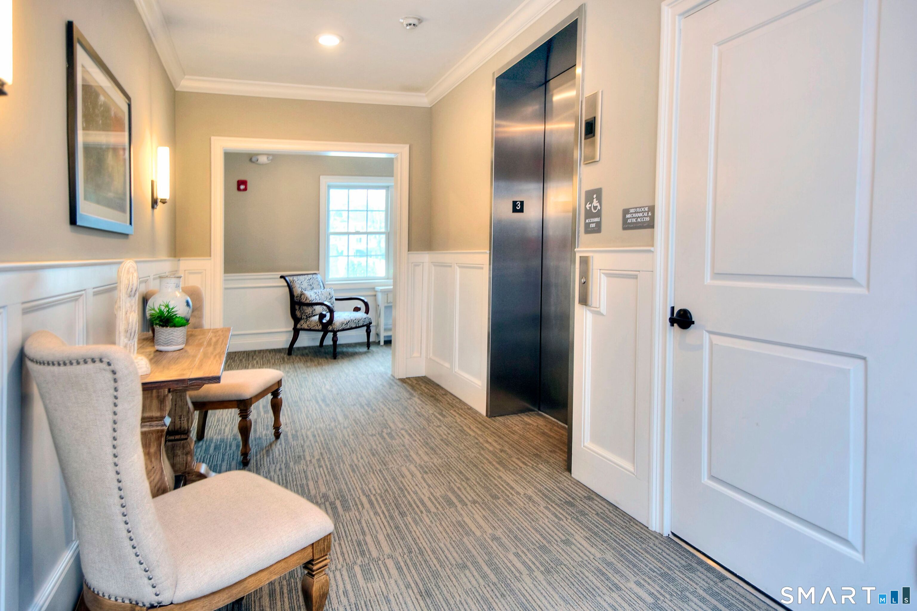 77 Sunset Lane, Unit 335 Ridgefield, CT 06877 - Photo 20 of 25 a workspace with furniture and wooden floor