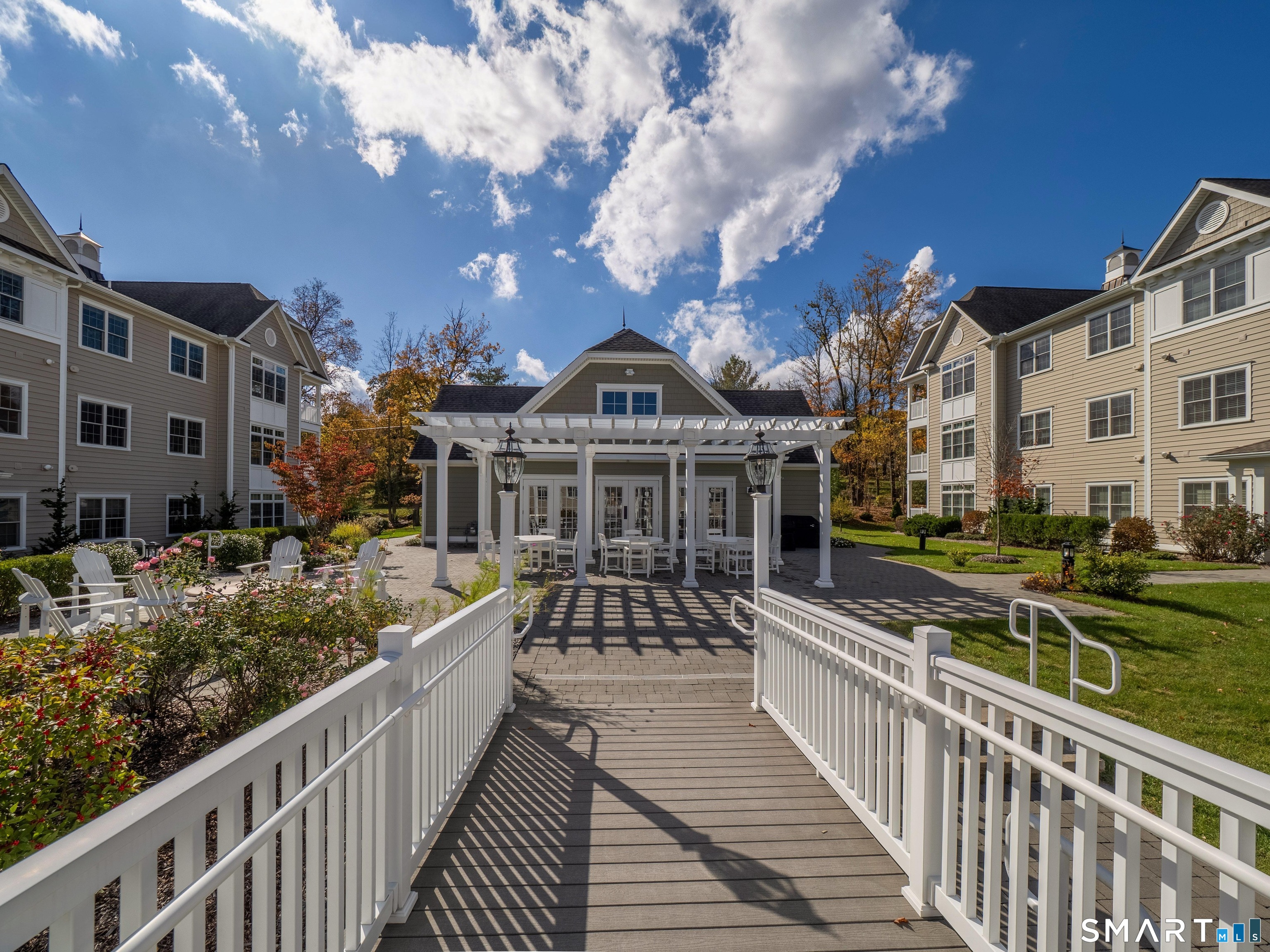 77 Sunset Lane, Unit 335 Ridgefield, CT 06877 - Photo 2 of 25 a view of a house with brick walls