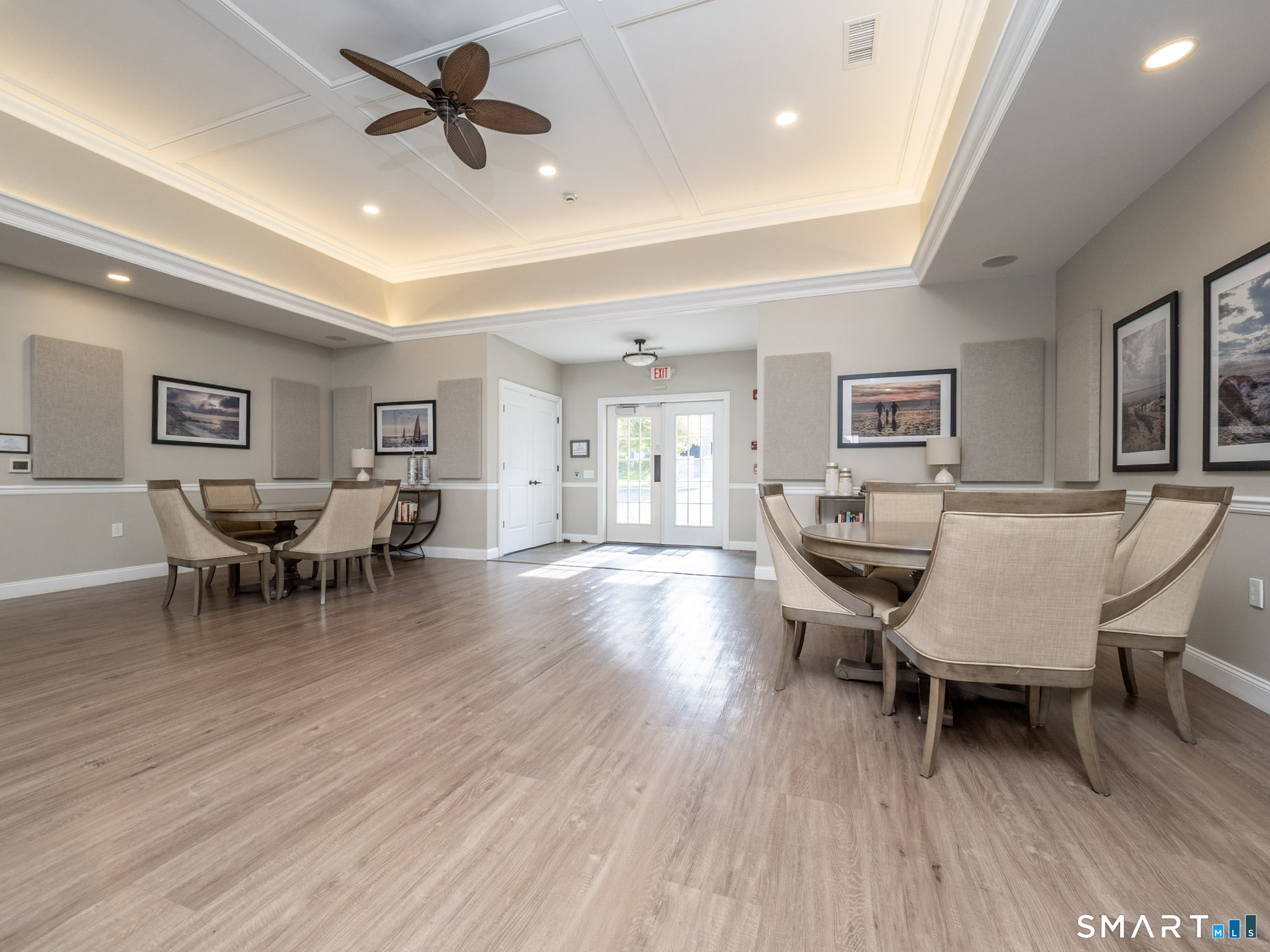 77 Sunset Lane, Unit 335 Ridgefield, CT 06877 - Photo 21 of 25 a living room with furniture and a wooden floor