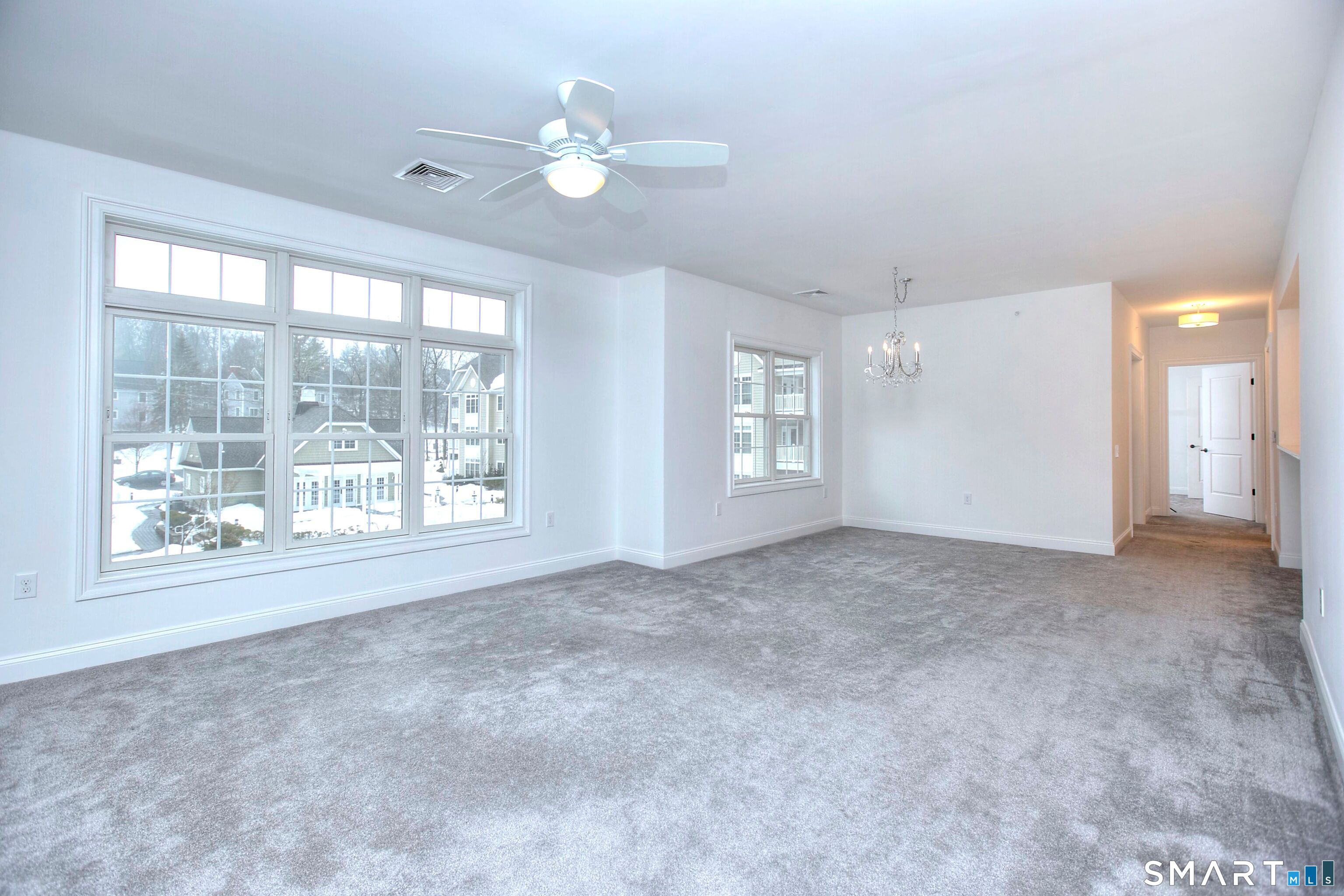 77 Sunset Lane, Unit 335 Ridgefield, CT 06877 - Photo 6 of 25 a view of an empty room with a window