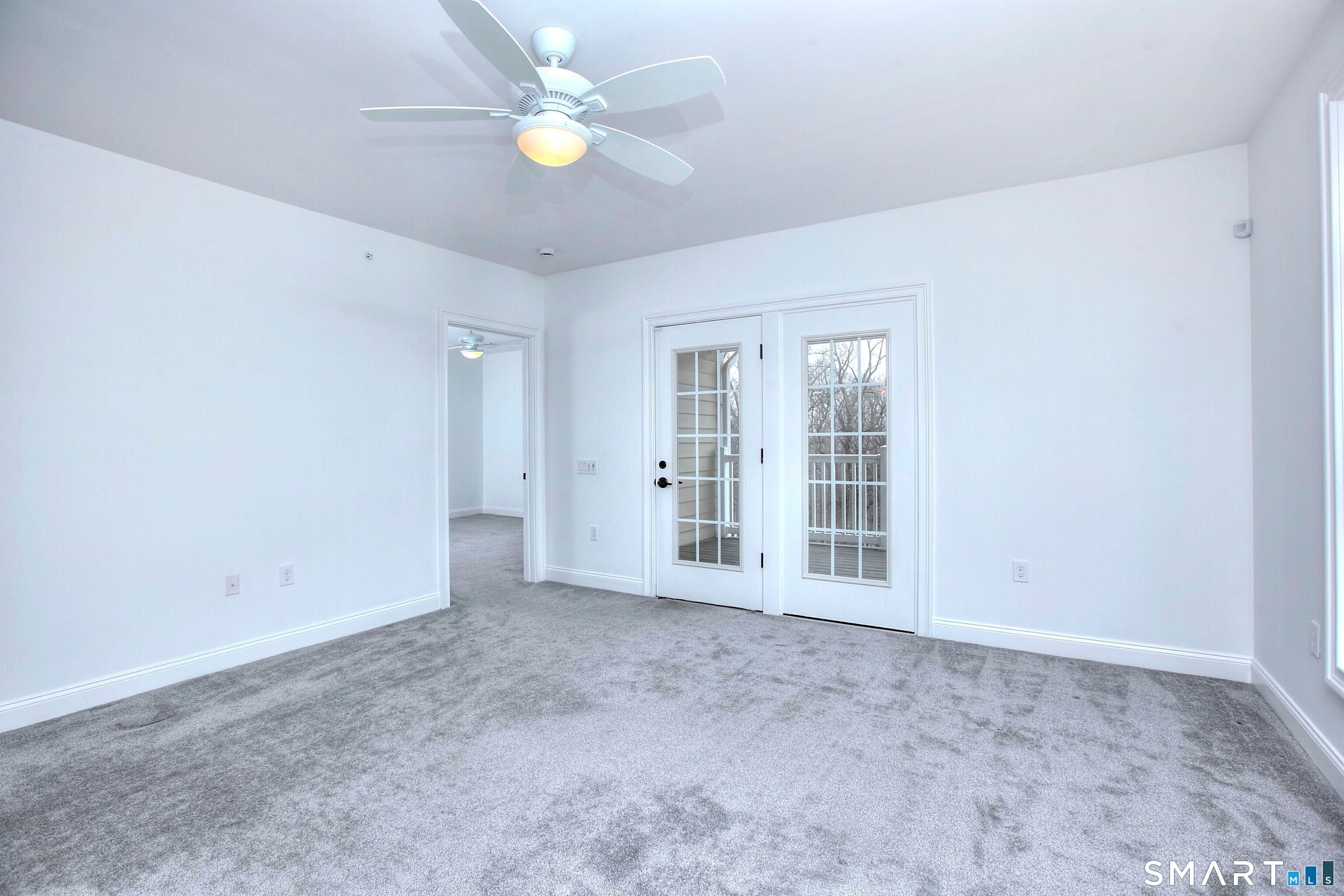 77 Sunset Lane, Unit 335 Ridgefield, CT 06877 - Photo 8 of 25 a view of an empty room with a window