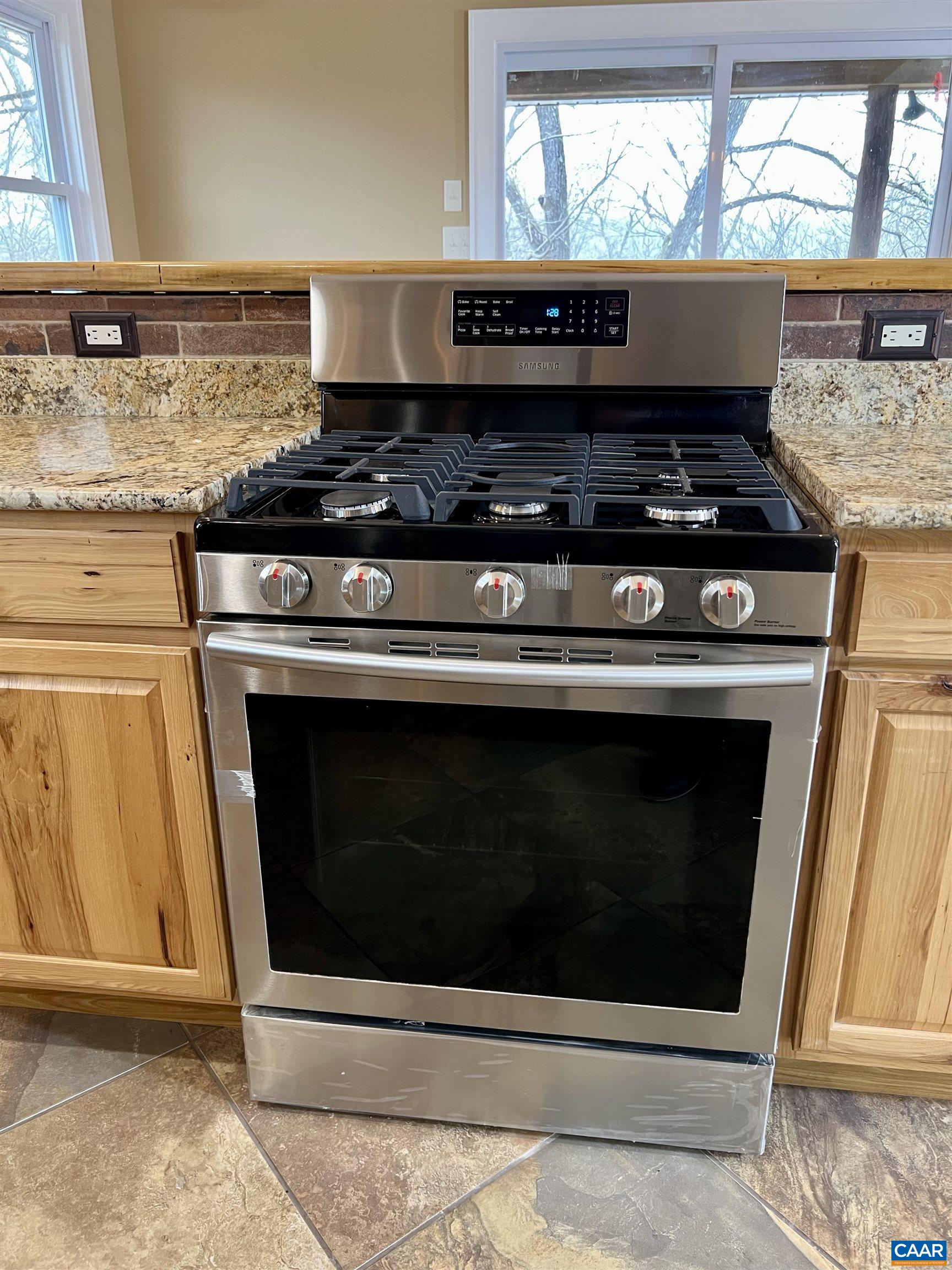8272 Faber Road Faber, VA 22938 - Photo 11 of 44 a stove top oven sitting inside of a kitchen