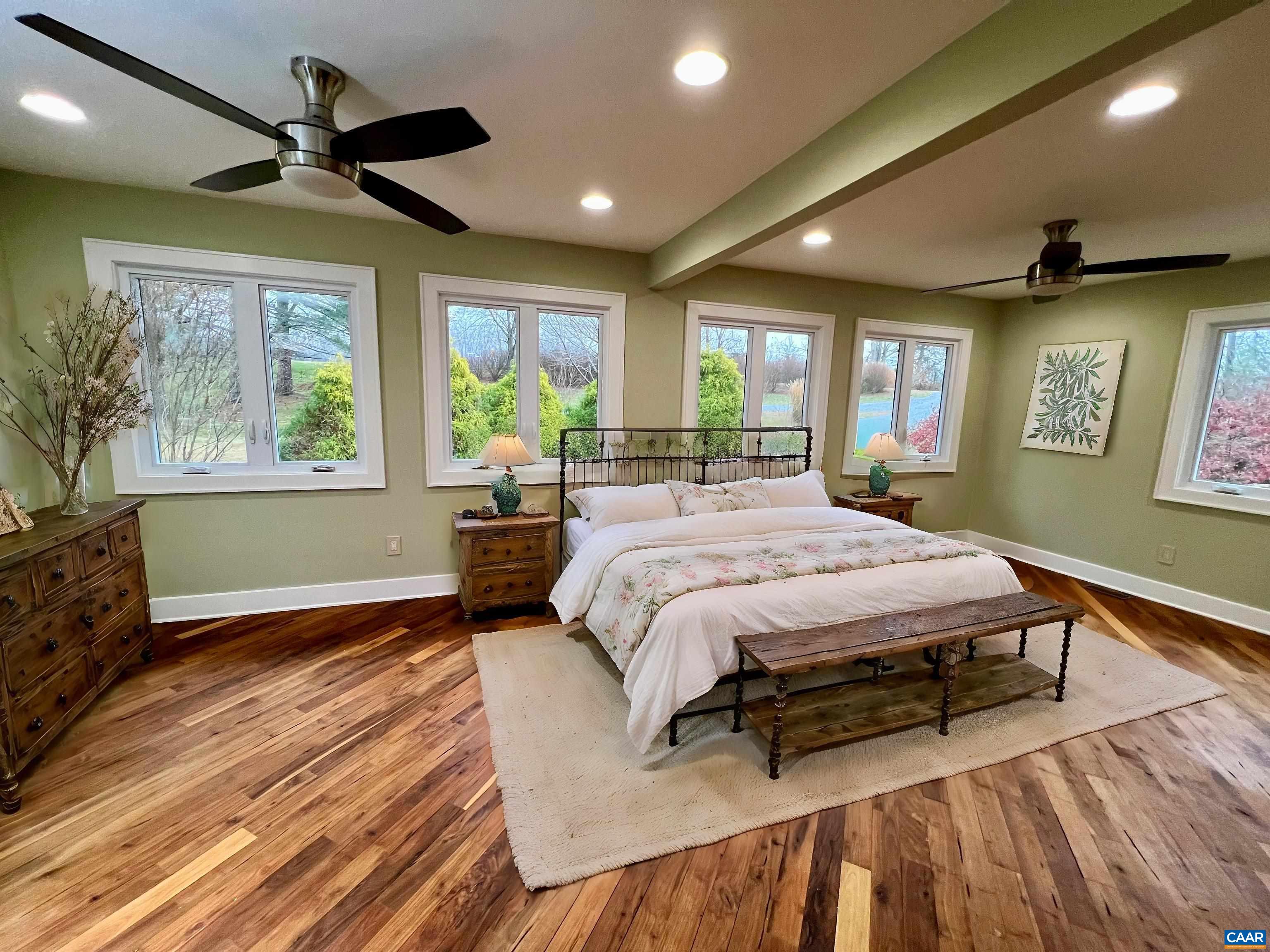 8272 Faber Road Faber, VA 22938 - Photo 15 of 44 a spacious bedroom with a bed and a large window
