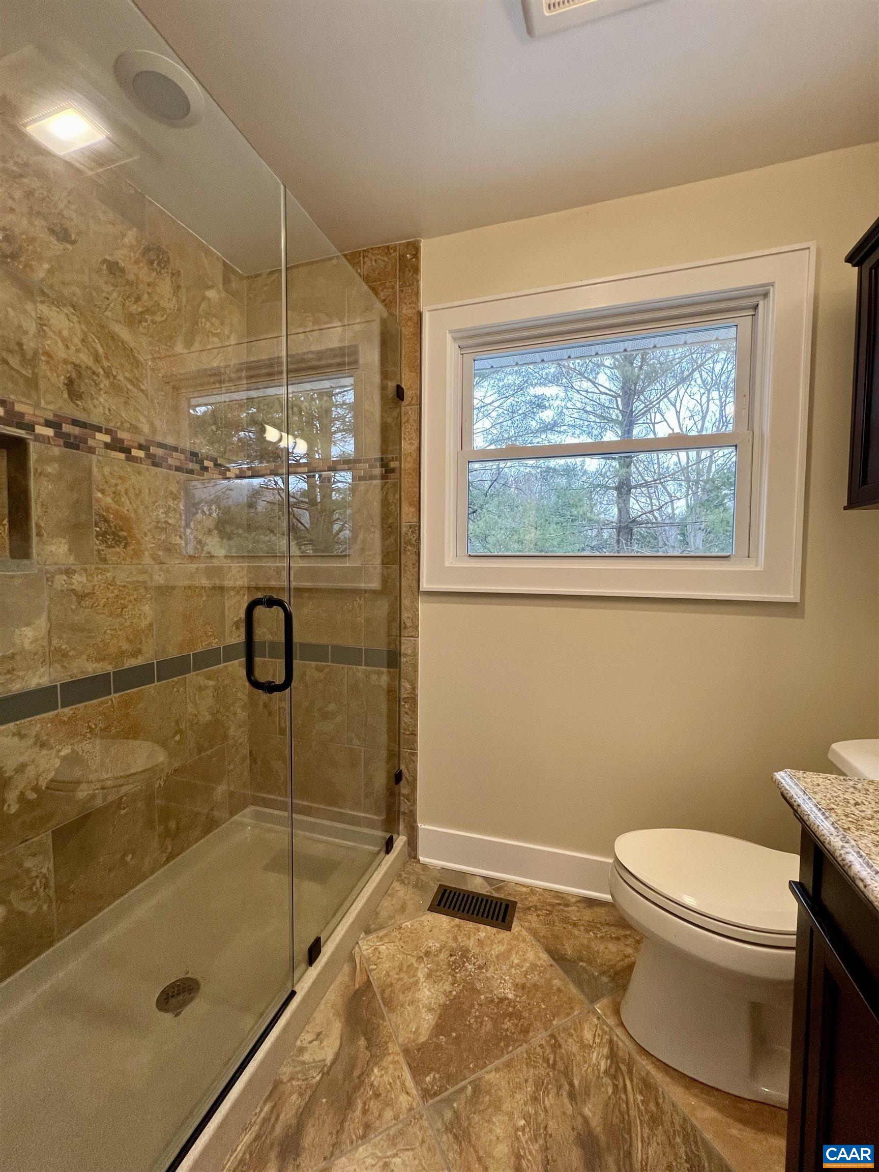 8272 Faber Road Faber, VA 22938 - Photo 18 of 44 a bathroom with a toilet and shower