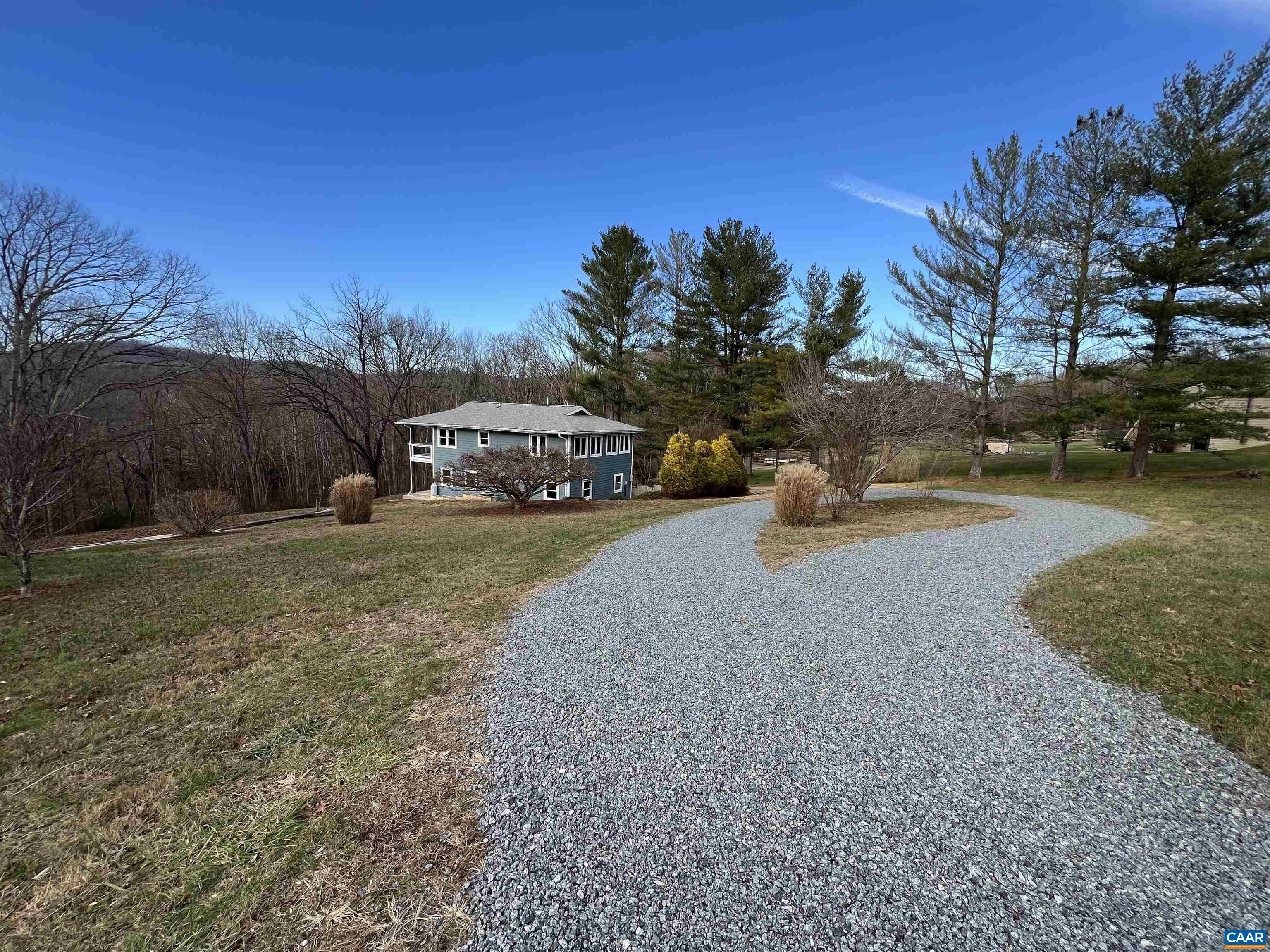 8272 Faber Road Faber, VA 22938 - Photo 2 of 44 a view of a yard with a house in the background