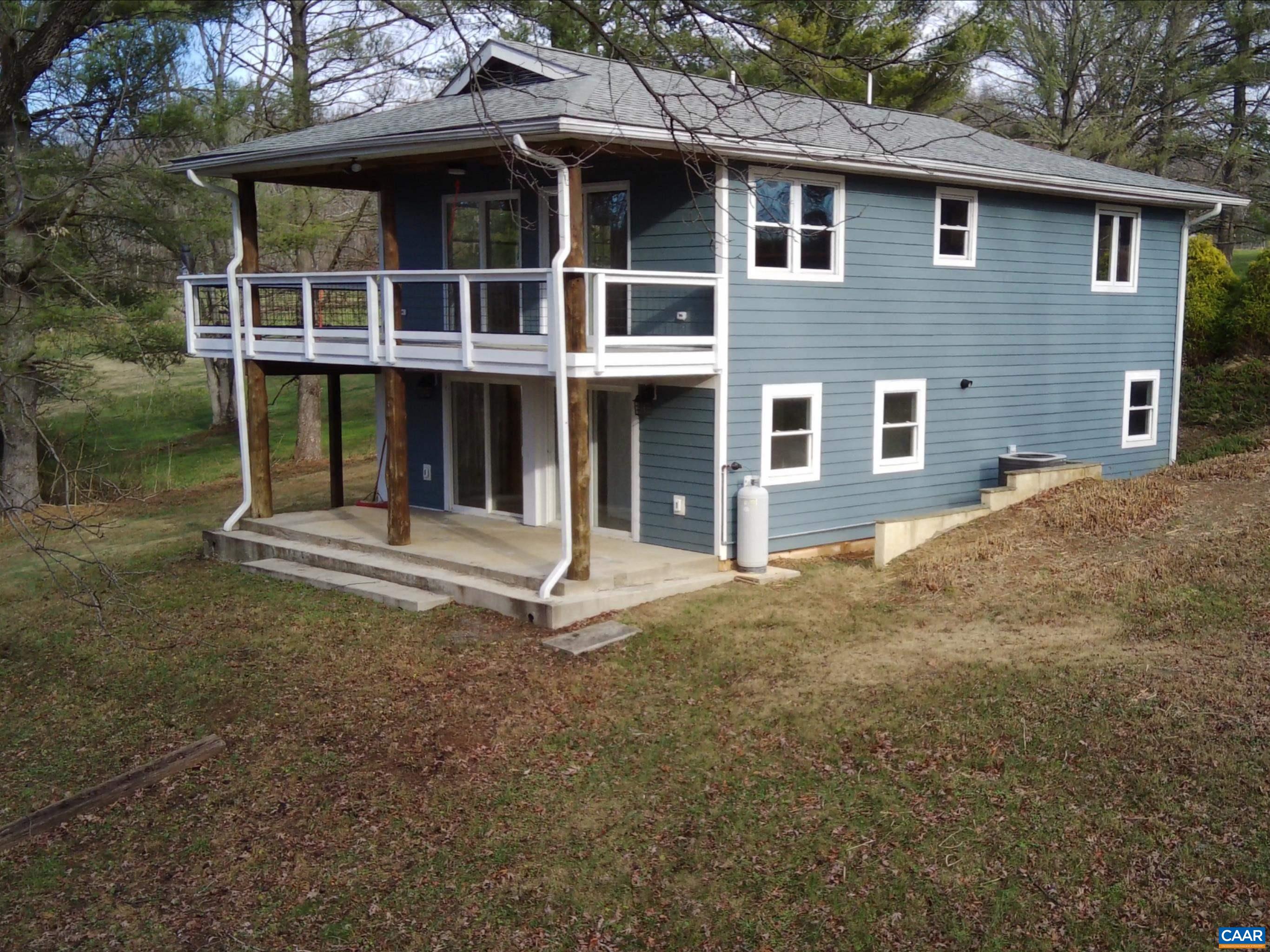 8272 Faber Road Faber, VA 22938 - Photo 4 of 44 a front view of a house with a yard