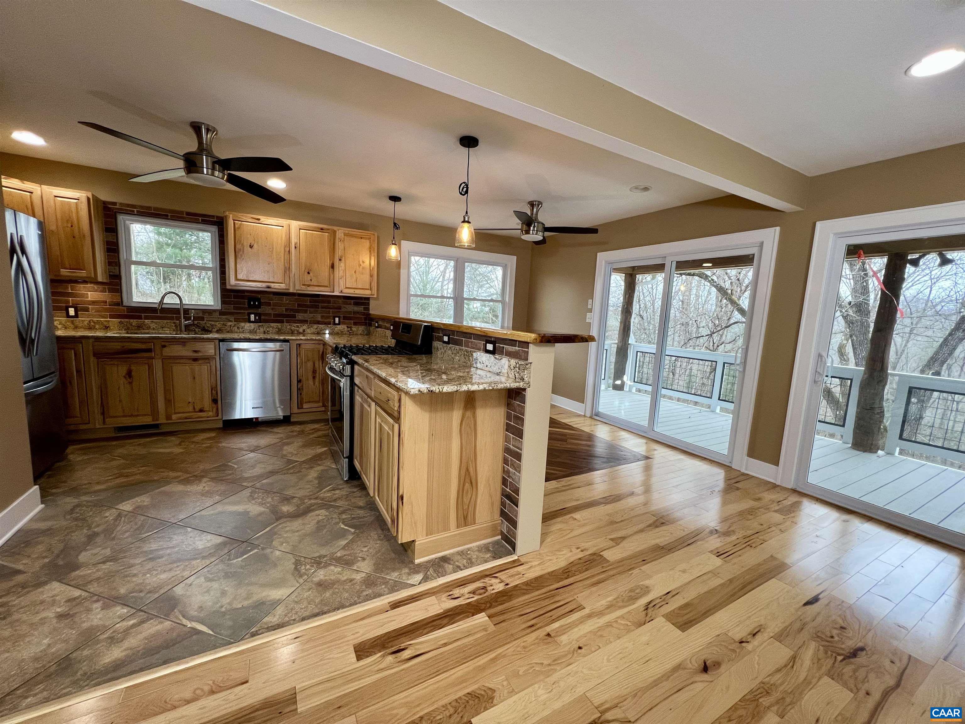 8272 Faber Road Faber, VA 22938 - Photo 6 of 44 a kitchen with stainless steel appliances granite countertop a stove oven and a refrigerator