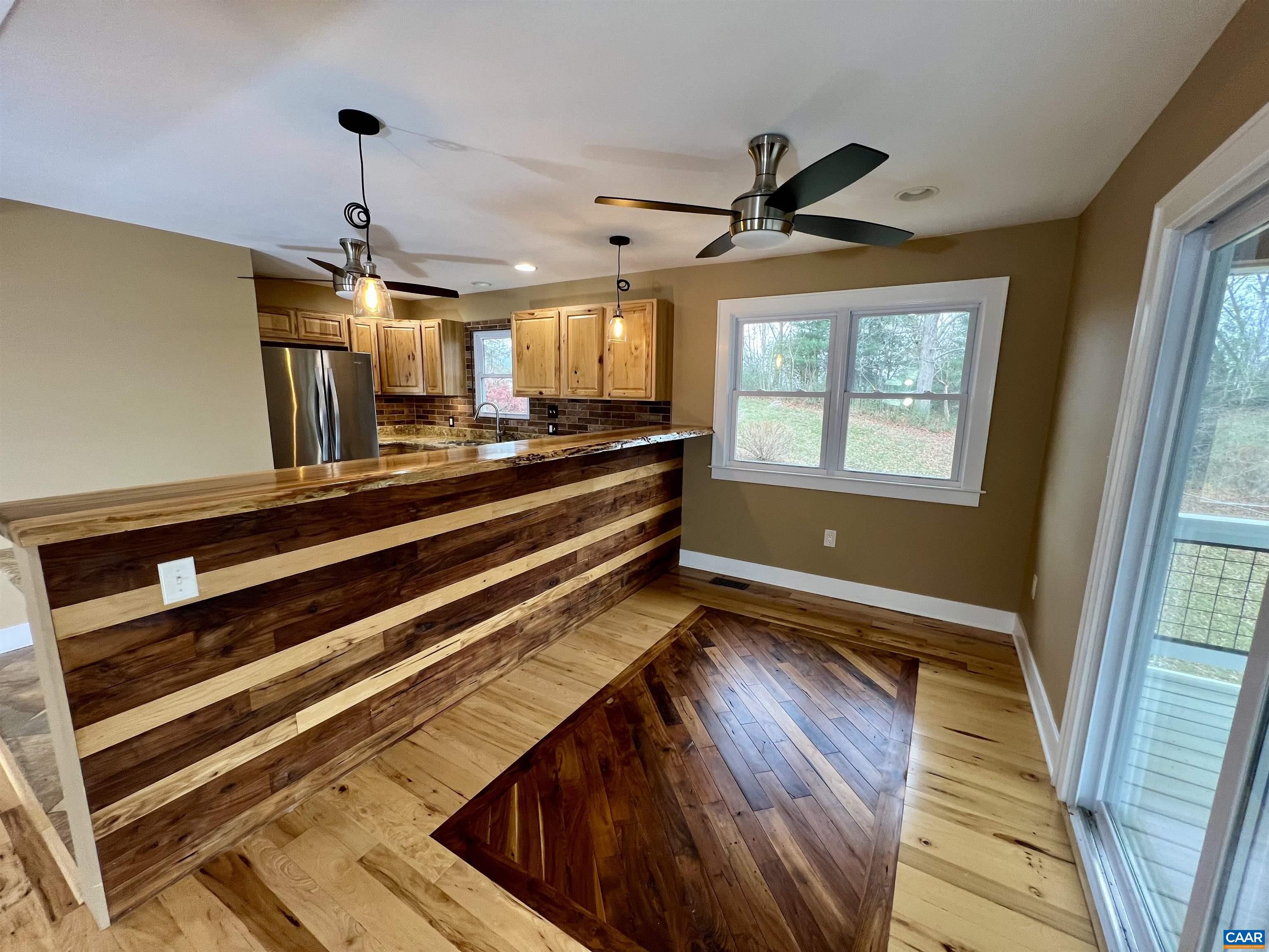 8272 Faber Road Faber, VA 22938 - Photo 10 of 44 a view of kitchen with wooden floor and windows