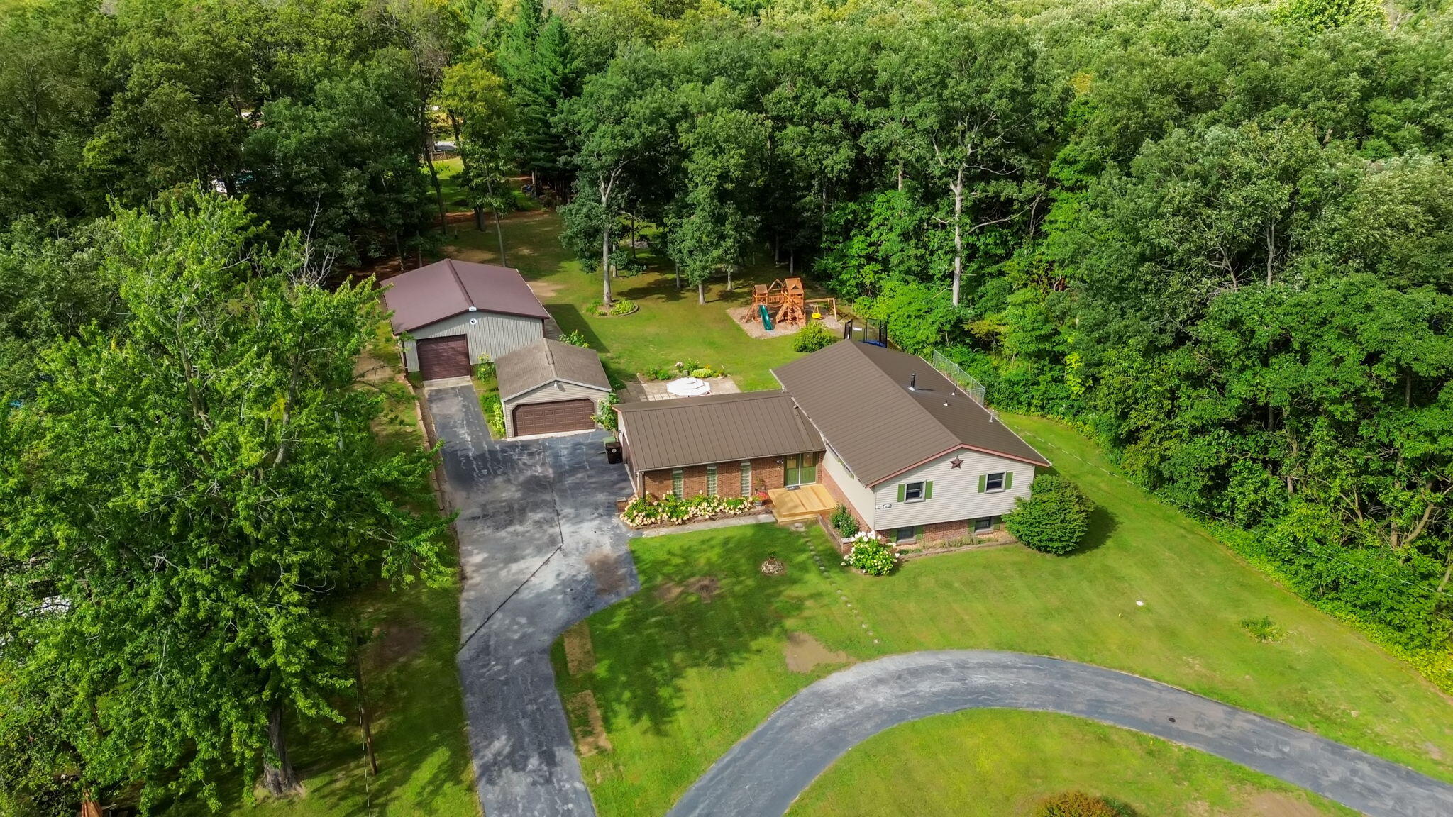 5592 East 1100th Street North Demotte, IN 46310 - Photo 3 of 77 an aerial view of a house with a garden