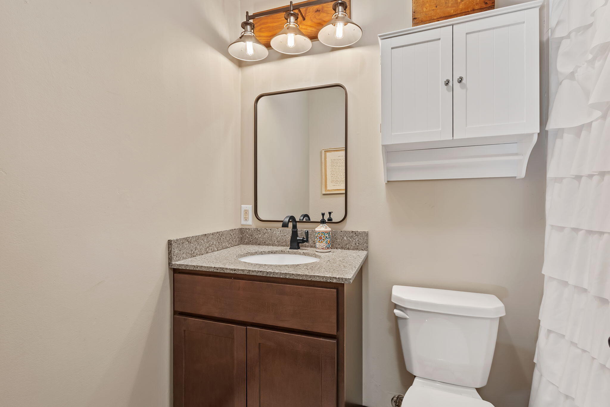 5592 East 1100th Street North Demotte, IN 46310 - Photo 38 of 77 a bathroom with a toilet sink and mirror