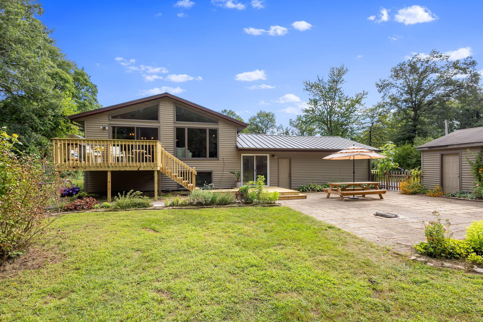 5592 East 1100th Street North Demotte, IN 46310 - Photo 54 of 77 a front view of house with yard patio and fire pit