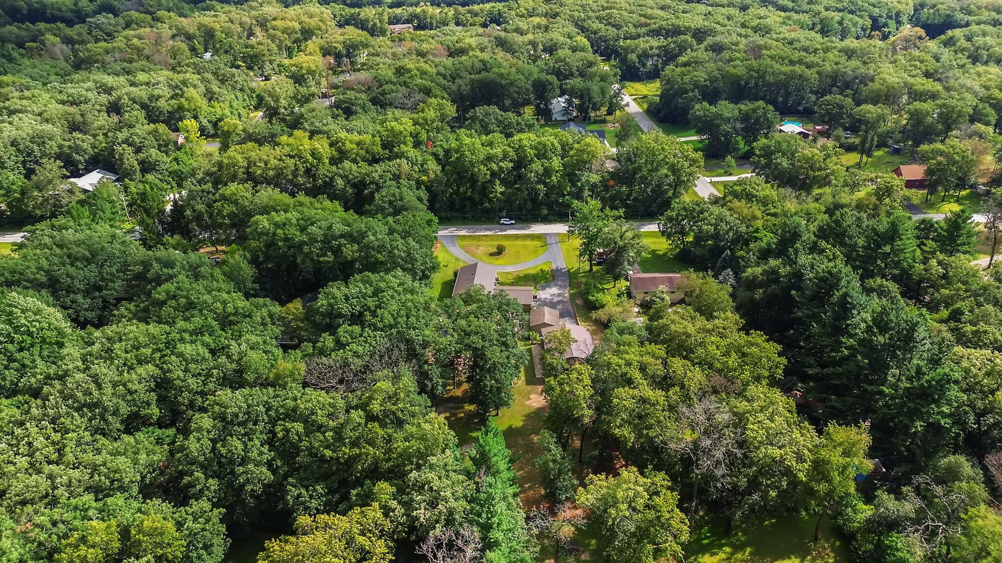 5592 East 1100th Street North Demotte, IN 46310 - Photo 66 of 77 an aerial view of a house with a yard and swimming pool