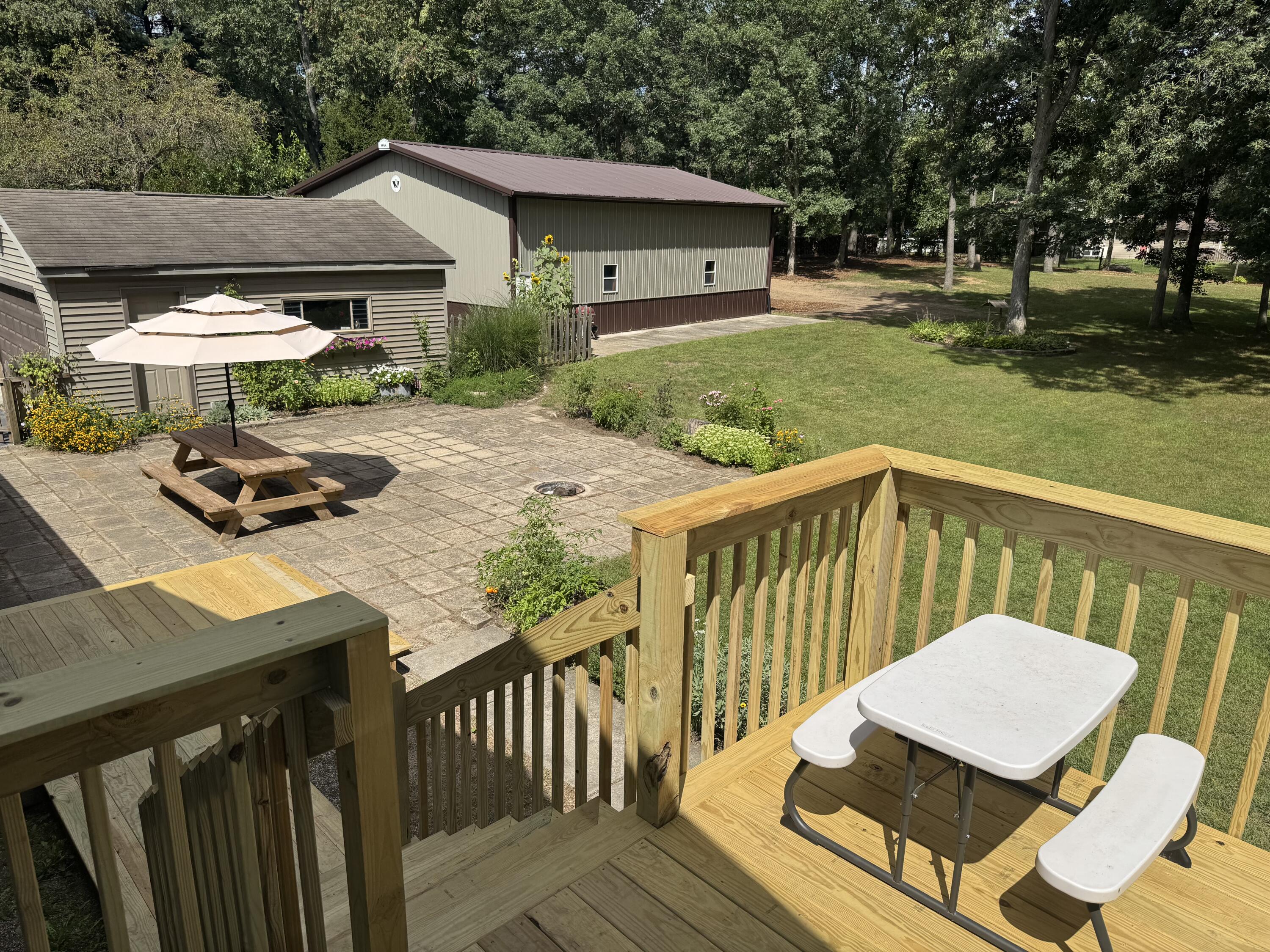 5592 East 1100th Street North Demotte, IN 46310 - Photo 73 of 77 a view of a patio with wooden floor