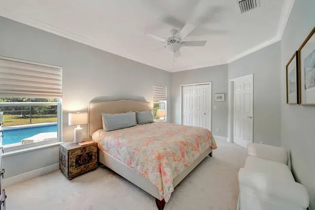 a bedroom with bed and window