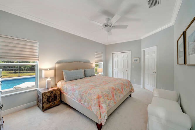 636 Gossamer Wing Way Sebastian, FL 32958 - Photo 11 of 34 a bedroom with a bed and a window