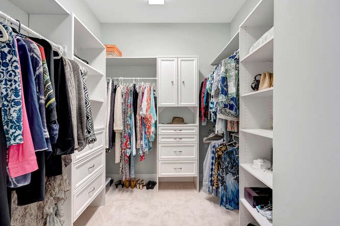 636 Gossamer Wing Way Sebastian, FL 32958 - Photo 15 of 34 a view of walk in closet with clothes