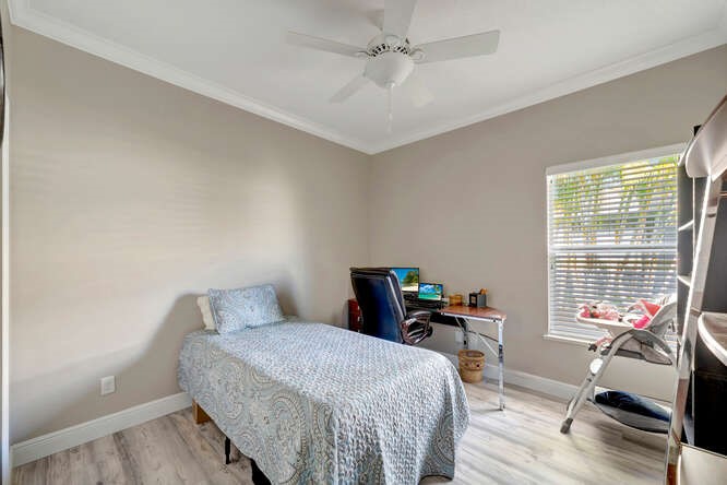 636 Gossamer Wing Way Sebastian, FL 32958 - Photo 16 of 36 a bedroom with a bed and a window