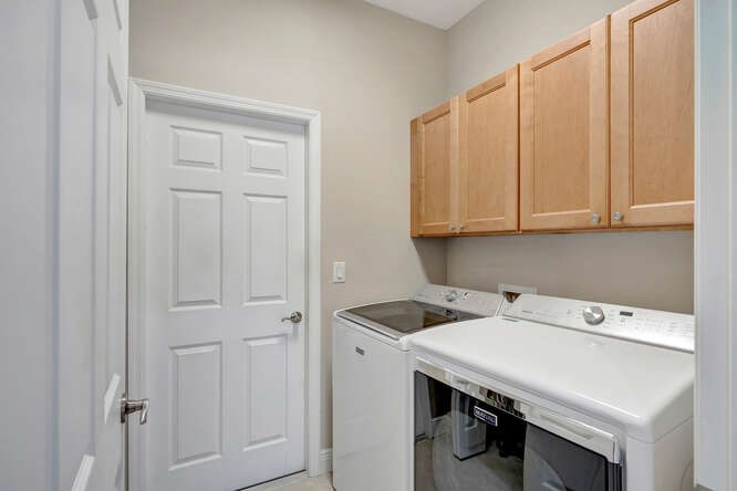 636 Gossamer Wing Way Sebastian, FL 32958 - Photo 20 of 36 a utility room with dryer and washer