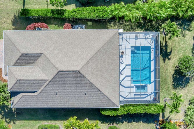 636 Gossamer Wing Way Sebastian, FL 32958 - Photo 26 of 36 a view of a house with a yard and potted plants
