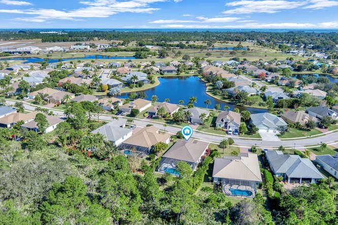 636 Gossamer Wing Way Sebastian, FL 32958 - Photo 28 of 36 an aerial view of residential houses with outdoor space and trees