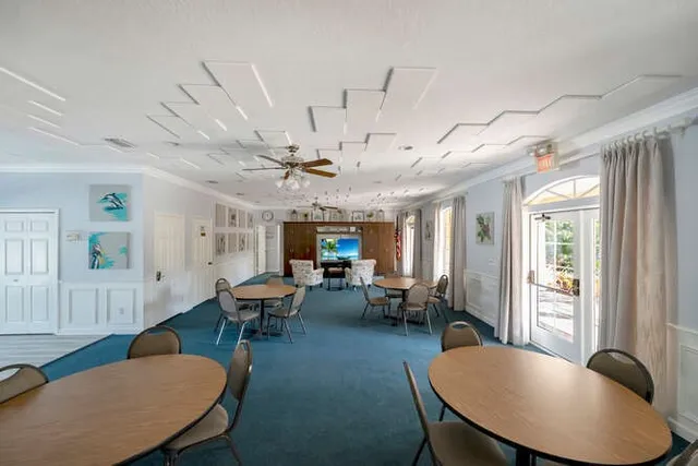 a view of a backyard with a house and a bench