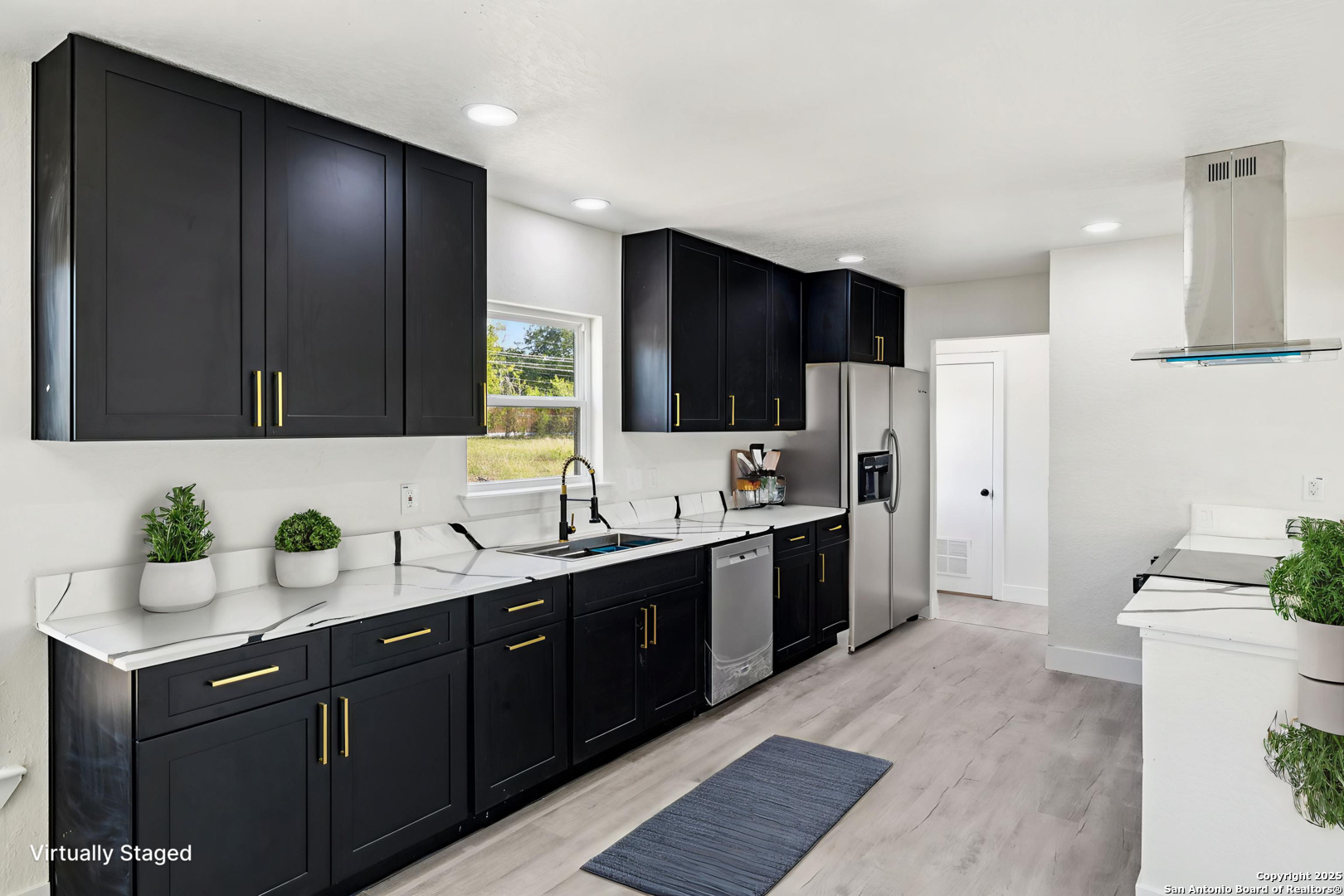 519 Jackson Keller Road San Antonio, TX 78216 - Photo 11 of 40 a kitchen with a sink cabinets and refrigerator