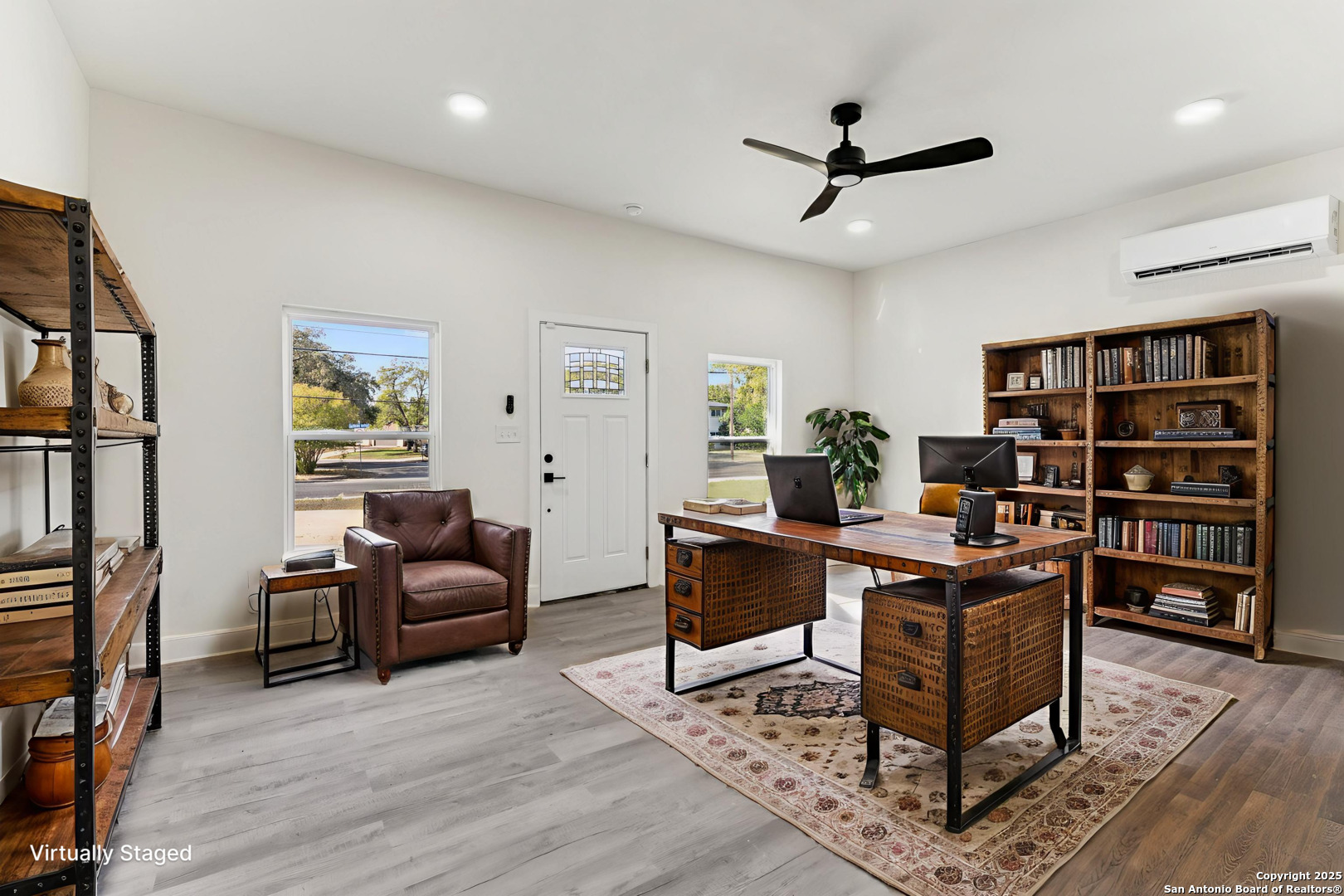 519 Jackson Keller Road San Antonio, TX 78216 - Photo 14 of 40 a view of a workspace with furniture and wooden floor