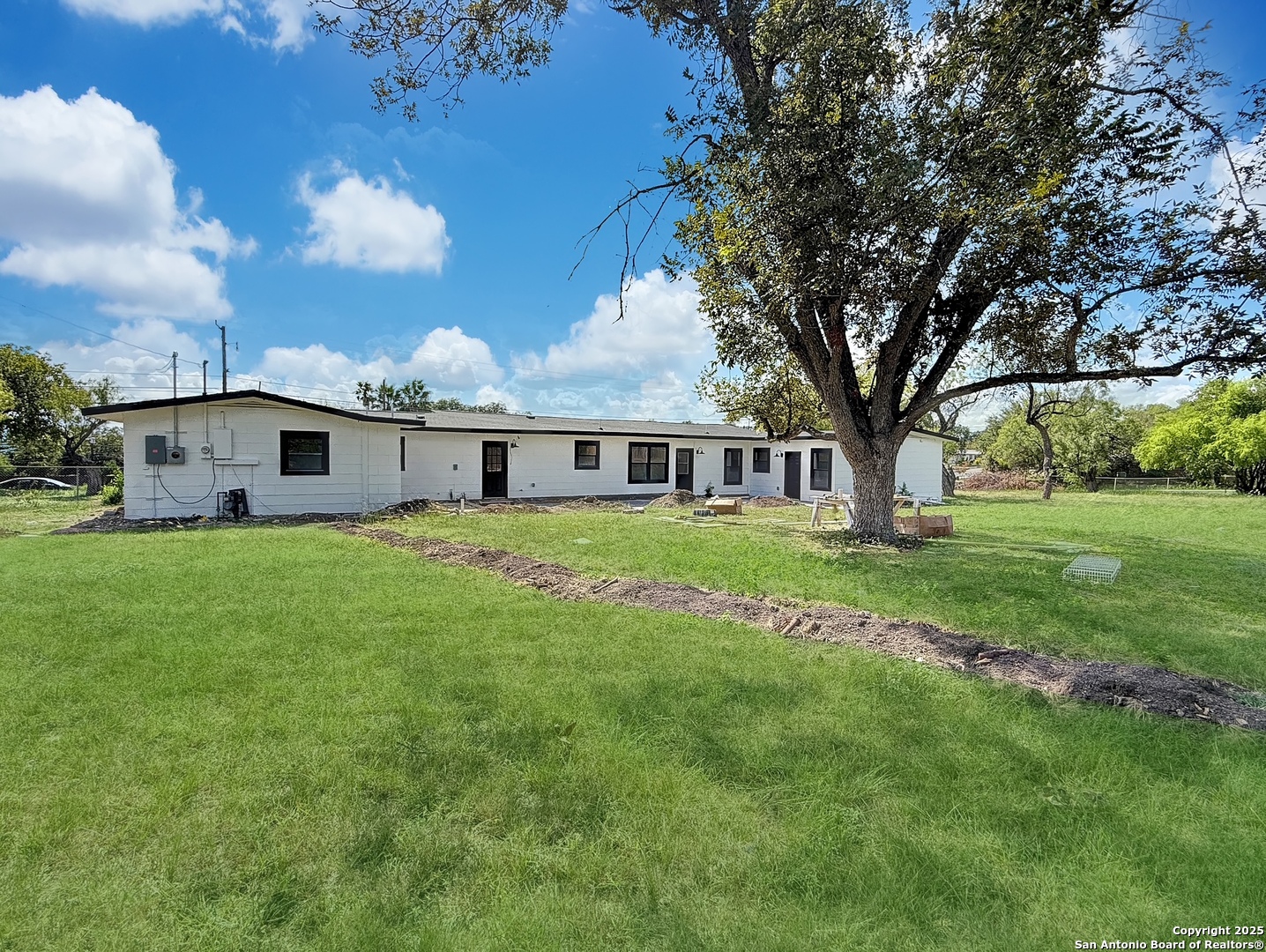 519 Jackson Keller Road San Antonio, TX 78216 - Photo 38 of 40 a front view of a house with a garden