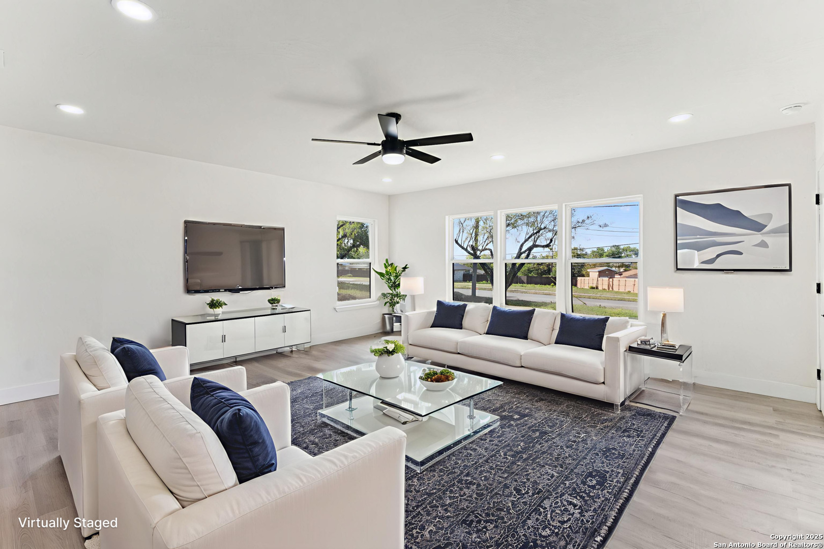 519 Jackson Keller Road San Antonio, TX 78216 - Photo 5 of 40 a living room with furniture and a flat screen tv