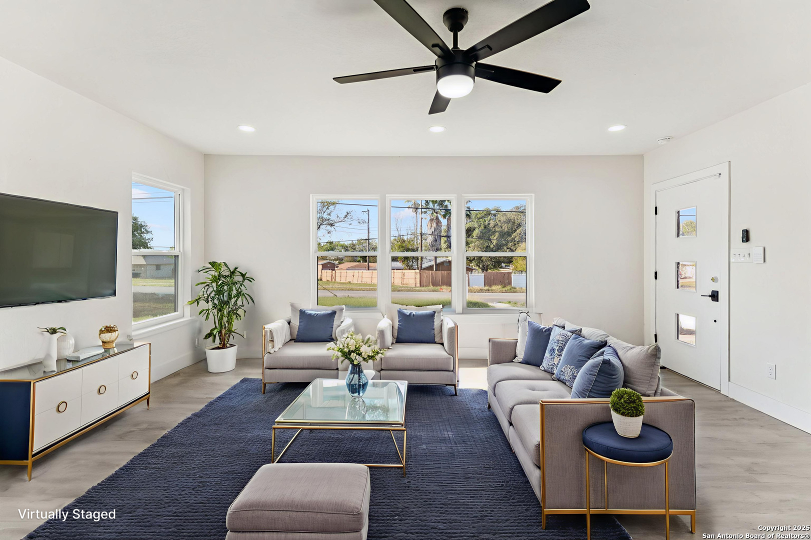 519 Jackson Keller Road San Antonio, TX 78216 - Photo 6 of 40 a living room with furniture and a flat screen tv