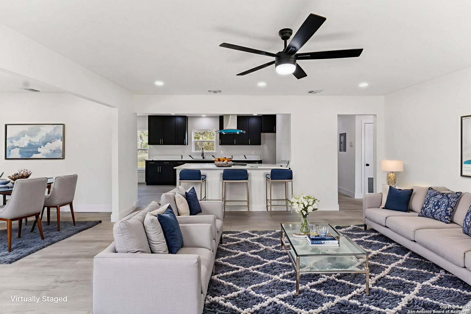 519 Jackson Keller Road San Antonio, TX 78216 - Photo 9 of 40 a living room with furniture a rug and a flat screen tv