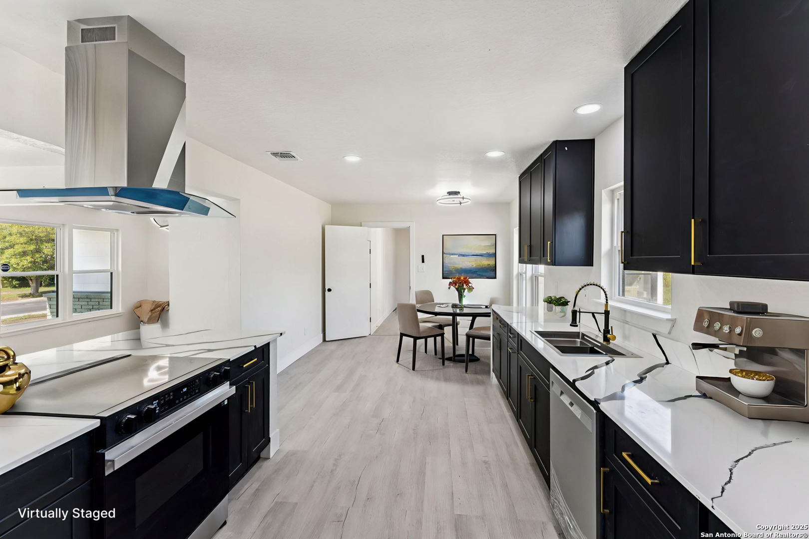519 Jackson Keller Road San Antonio, TX 78216 - Photo 10 of 40 a kitchen with stainless steel appliances a sink stove and cabinets