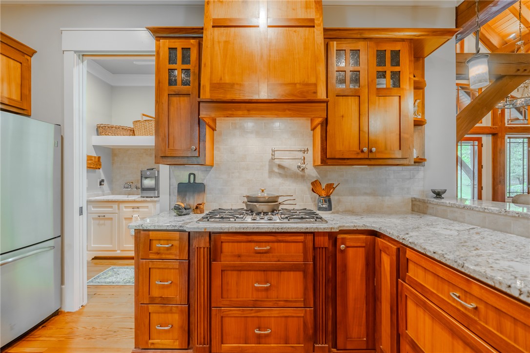 102 State Rd S-39-143 Sunset, SC 29685 - Photo 18 of 47 This spacious kitchen offers a gas range, stainless steel appliances, and ample storage.