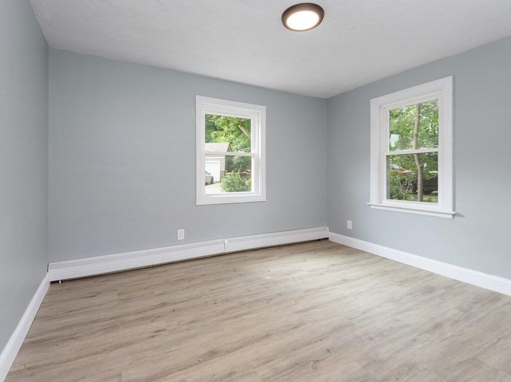 25 Highland Park Road Rutland, MA 01543 - Photo 23 of 33 an empty room with wooden floor and windows