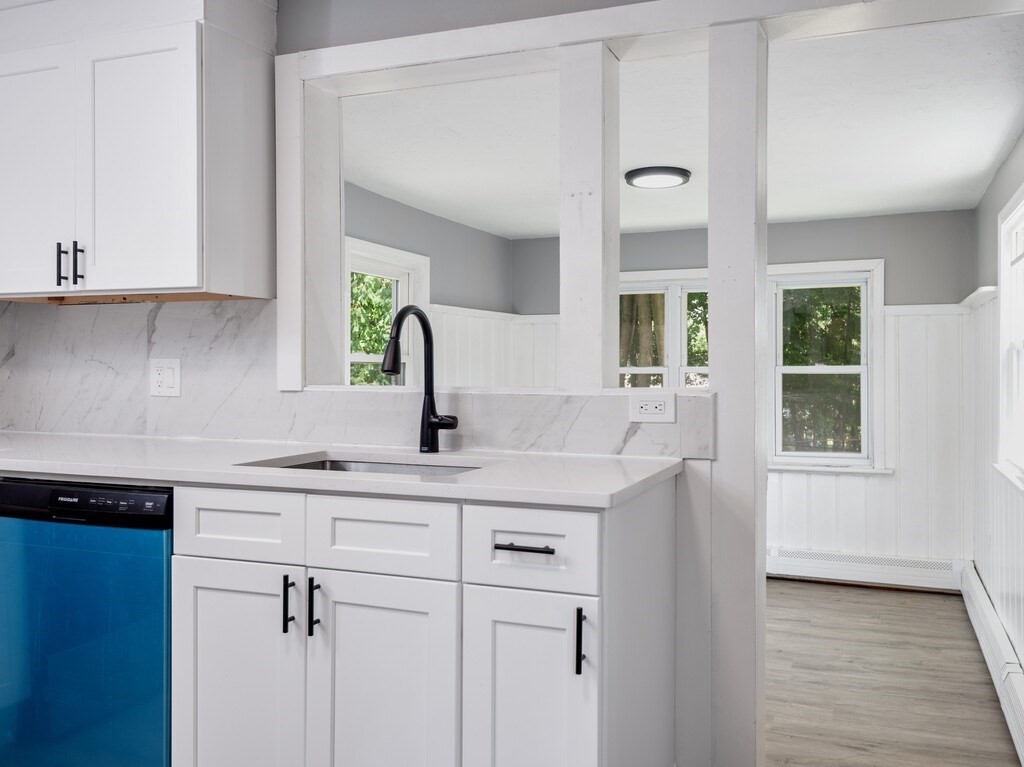 25 Highland Park Road Rutland, MA 01543 - Photo 7 of 33 a kitchen with a sink and cabinets