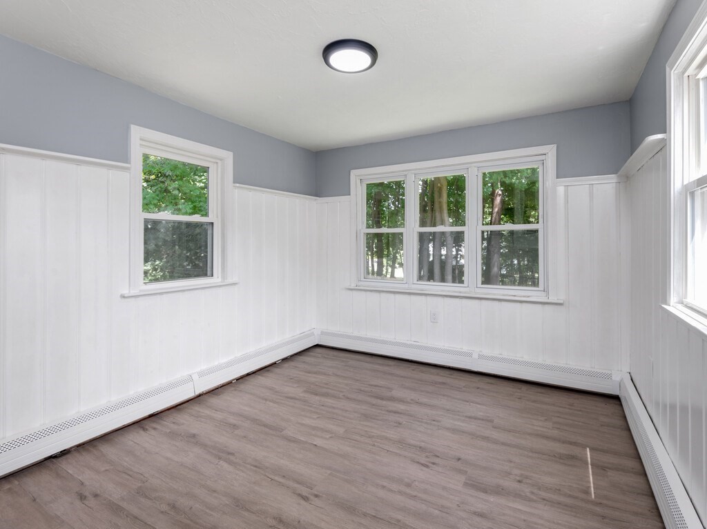 25 Highland Park Road Rutland, MA 01543 - Photo 8 of 33 a view of an empty room with wooden floor and a window