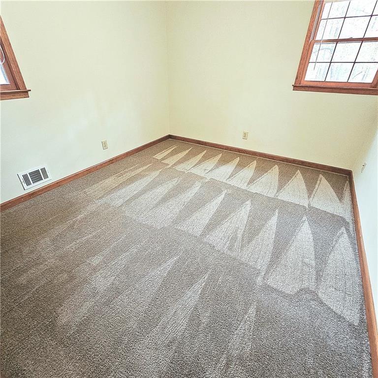 1955 Morgan Trace Canton, GA 30115 - Photo 13 of 17 a view of empty room with windows