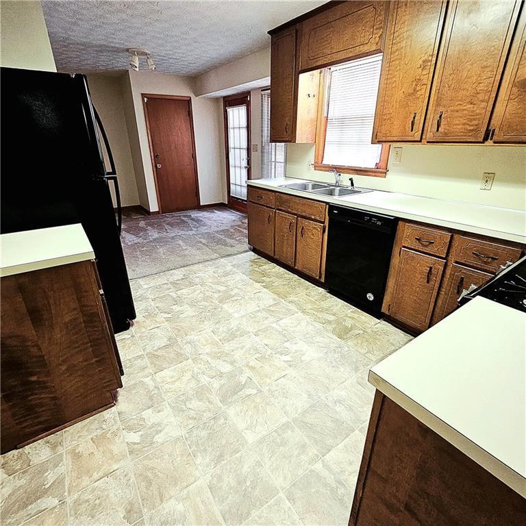 1955 Morgan Trace Canton, GA 30115 - Photo 8 of 17 a kitchen with stainless steel appliances a sink stove and cabinets
