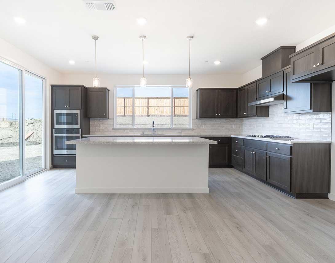 312 West Pasqua Glen Mountain House, CA 95391 - Photo 7 of 16 a large kitchen with stainless steel appliances kitchen island a large counter top and a wooden floors