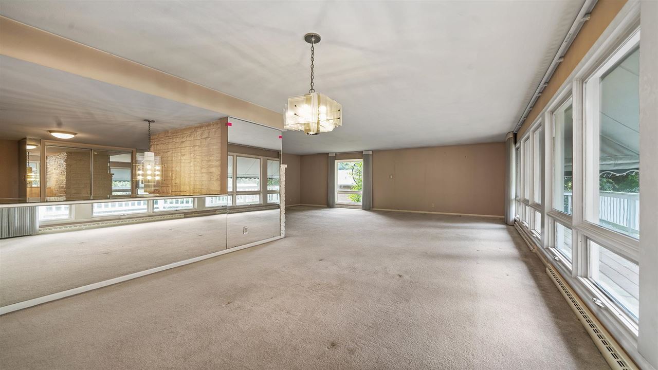 4114 Landstrom Road Rockford, IL 61114 - Photo 12 of 38 a view of a big room with windows and chandelier