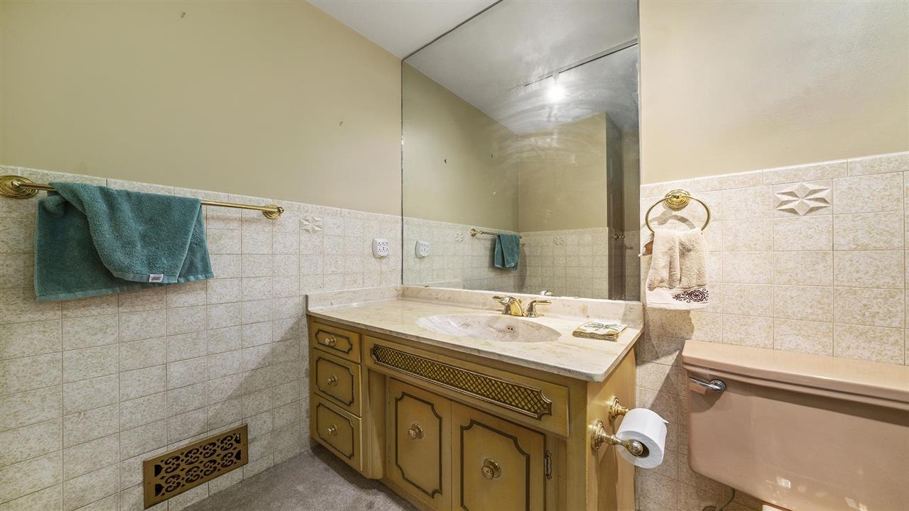 4114 Landstrom Road Rockford, IL 61114 - Photo 18 of 38 a bathroom with a sink and a mirror