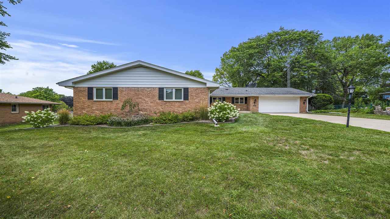 4114 Landstrom Road Rockford, IL 61114 - Photo 2 of 38 a front view of house with yard and green space